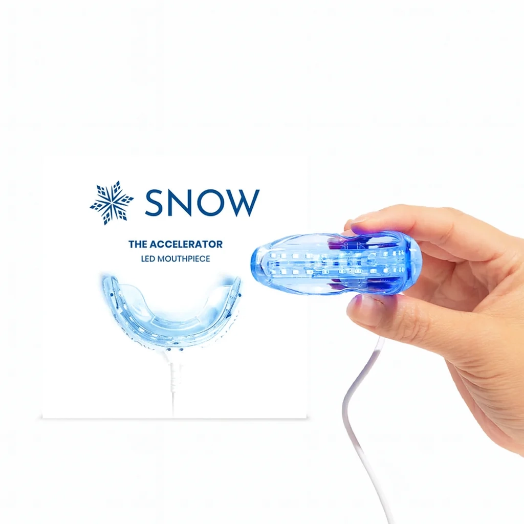 Snow® LED Teeth Whitening Mouthpiece held in a hand